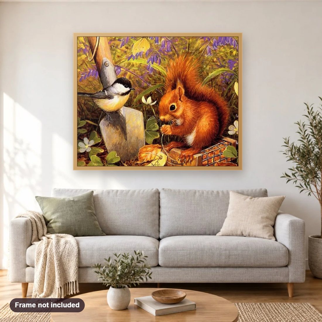 Squirrel & Sparrow diamond painting shown framed on a living room wall above a sofa