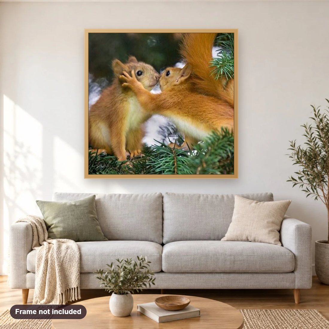 Squirrels in Love diamond painting shown framed on a living room wall above a sofa