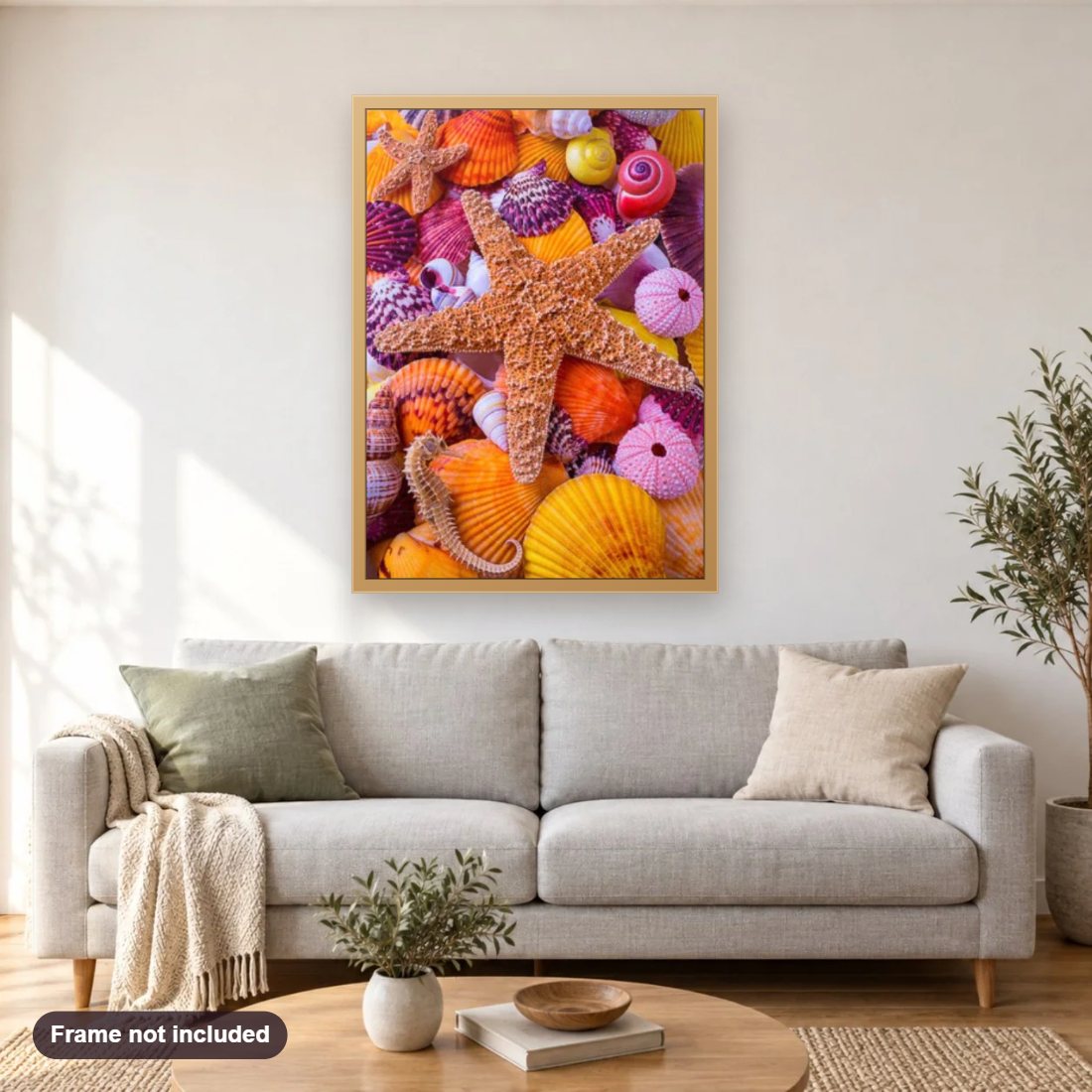 Star Fish Among Sea Shells diamond painting shown framed on a living room wall above a sofa