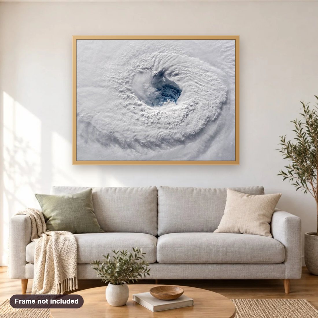 Staring Down Hurricane Florence diamond painting shown framed on a living room wall above a sofa