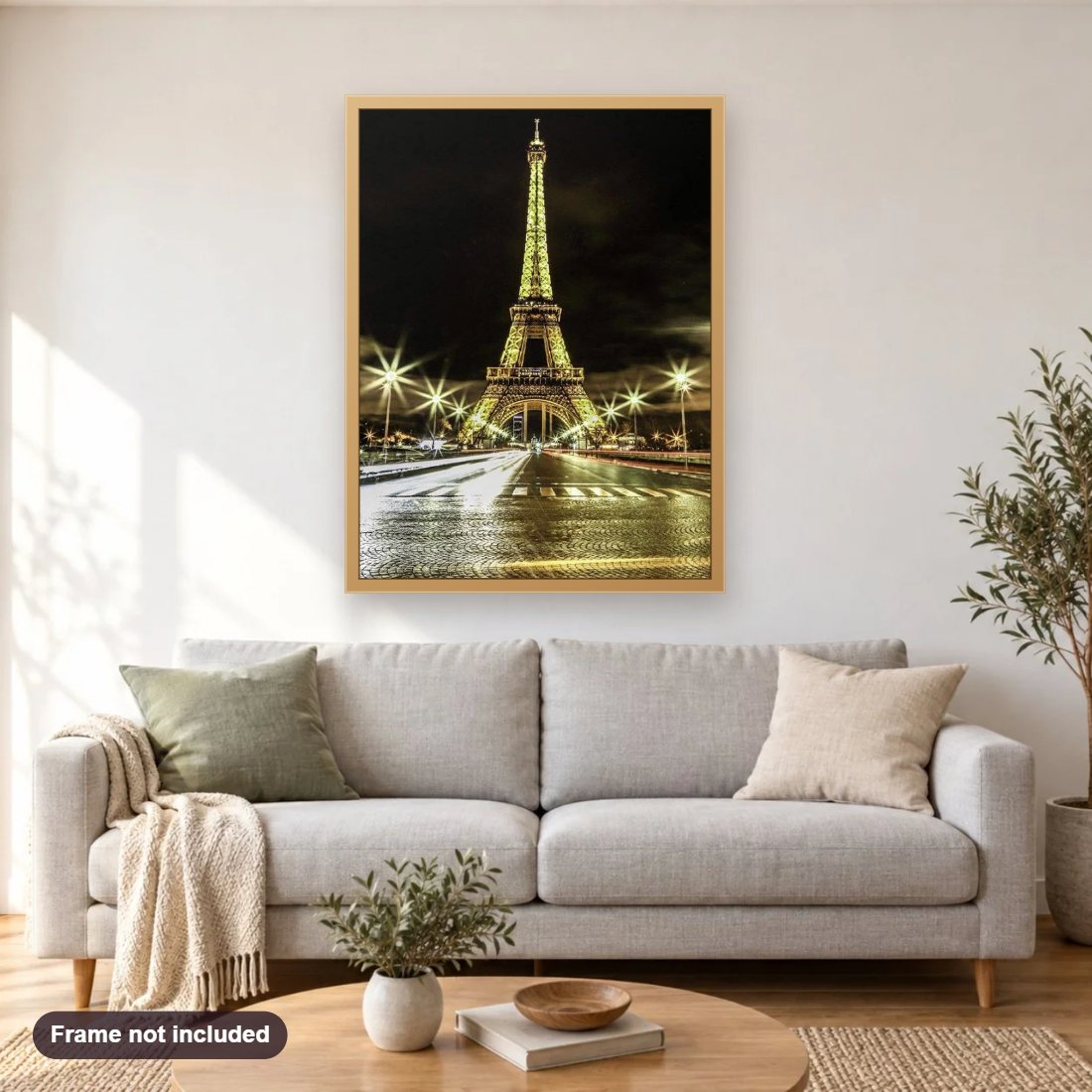 Stunning Eiffel Tower in Night Lights diamond painting shown framed on a living room wall above a sofa
