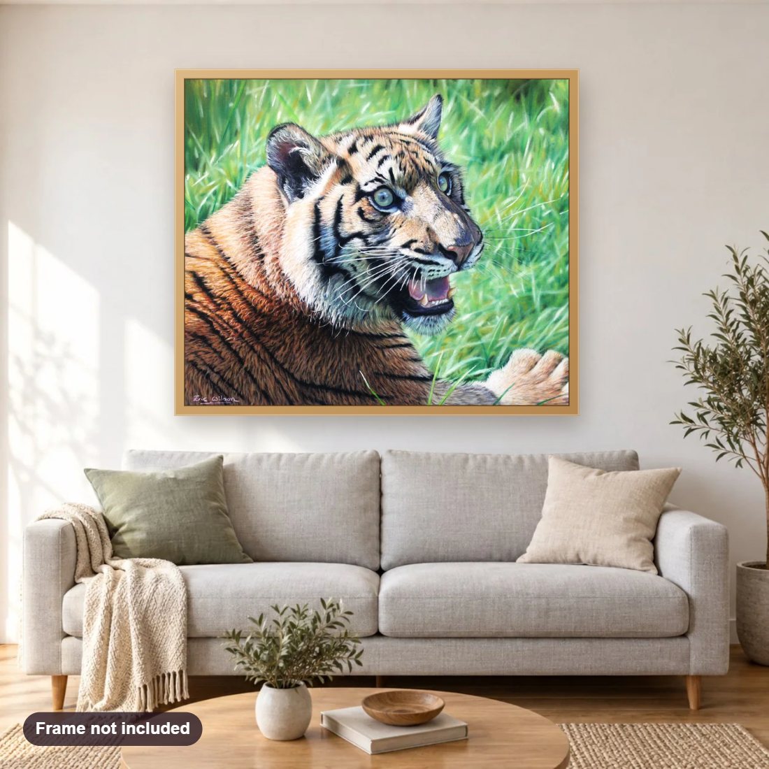 Sumatran Tiger Cub diamond painting shown framed on a living room wall above a sofa