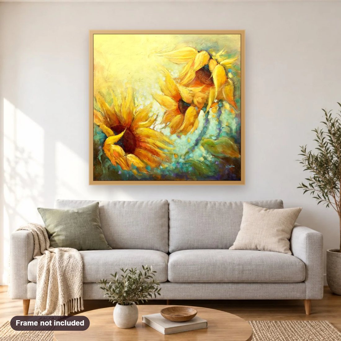Sunbathing diamond painting shown framed on a living room wall above a sofa