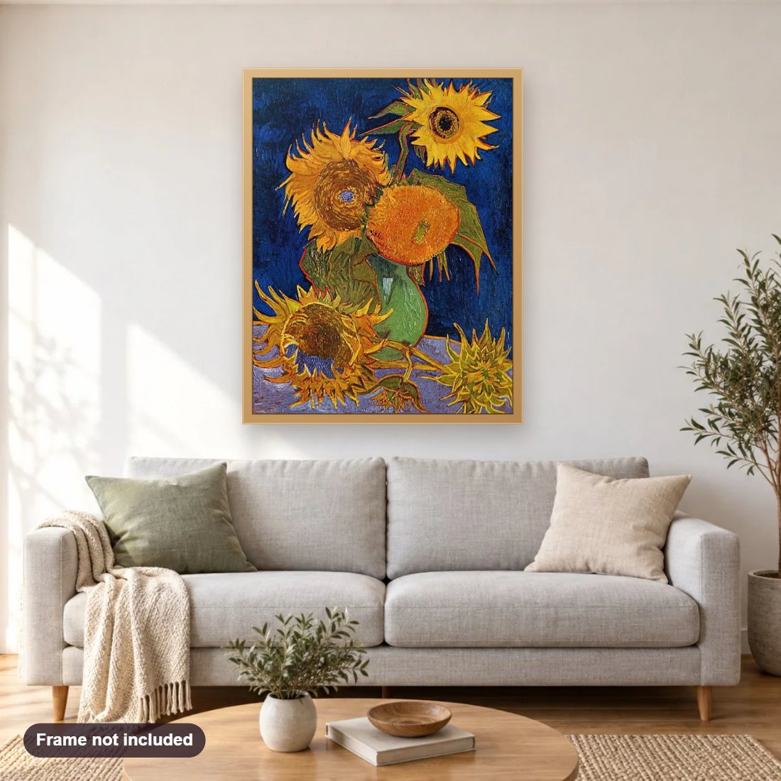 Sunflowers diamond painting shown framed on a living room wall above a sofa