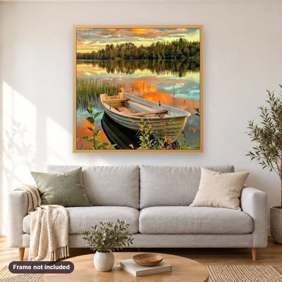Sunset Lake View diamond painting shown framed on a living room wall above a sofa