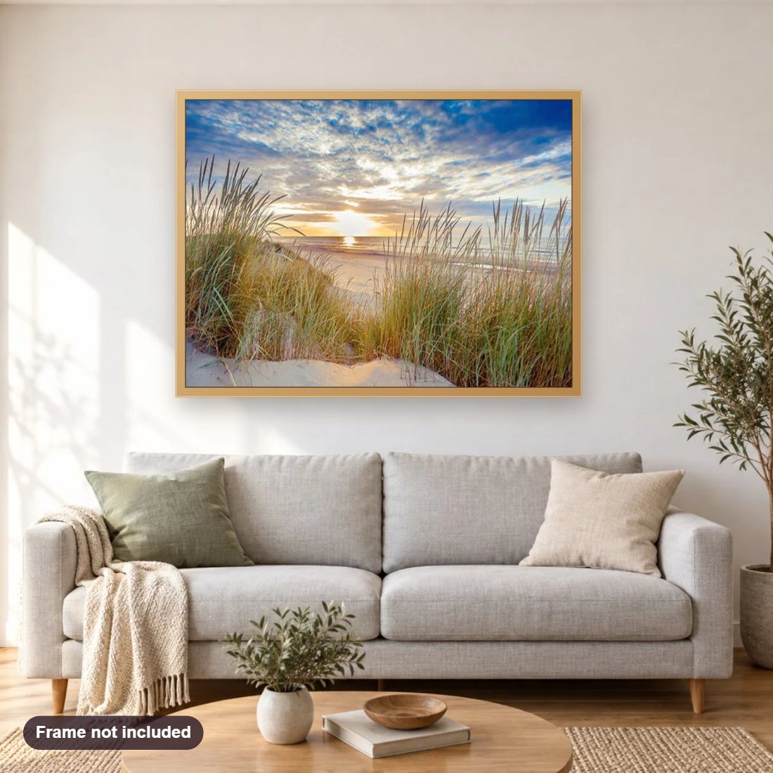 Sunset Landscape diamond painting shown framed on a living room wall above a sofa