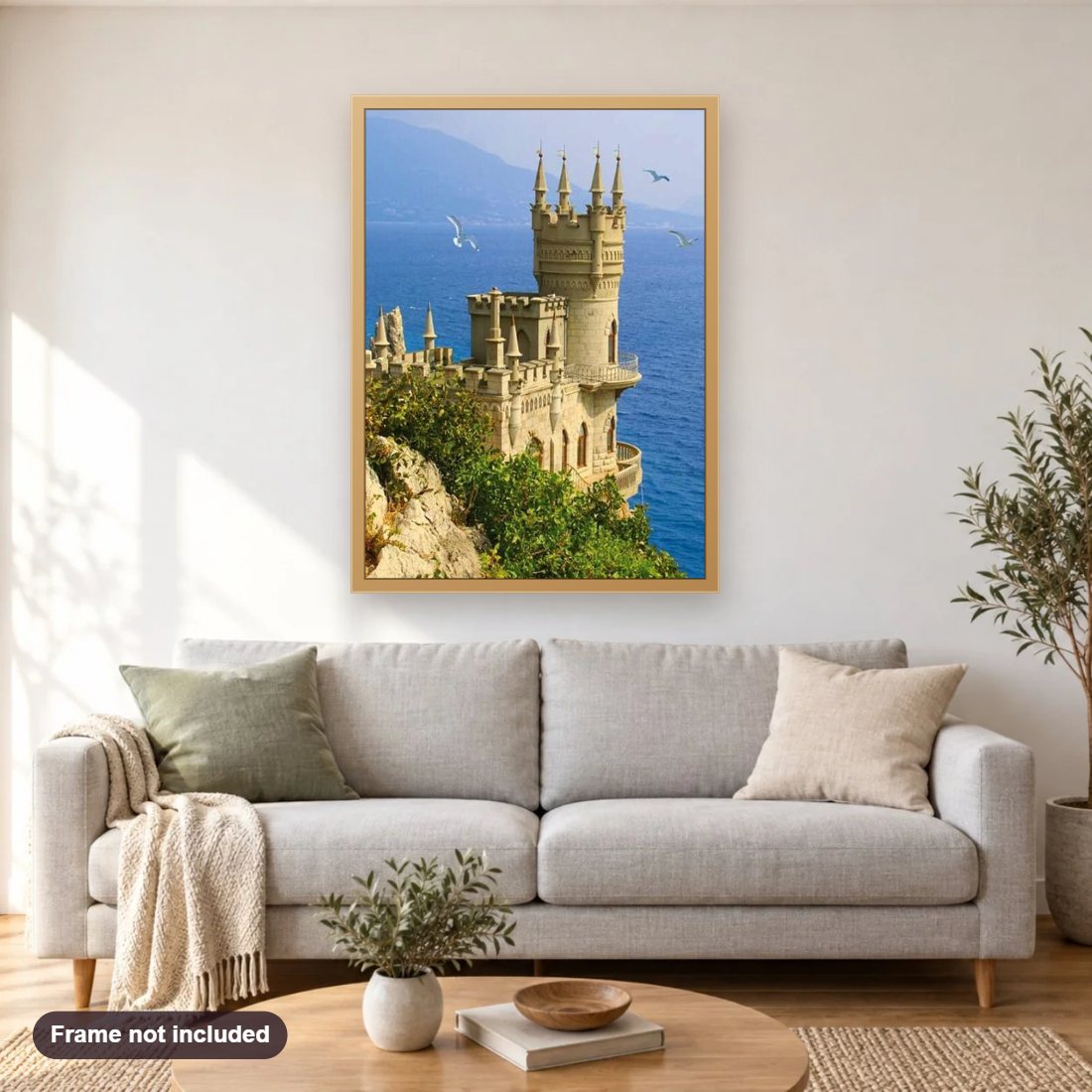 Swallow's Nest diamond painting shown framed on a living room wall above a sofa