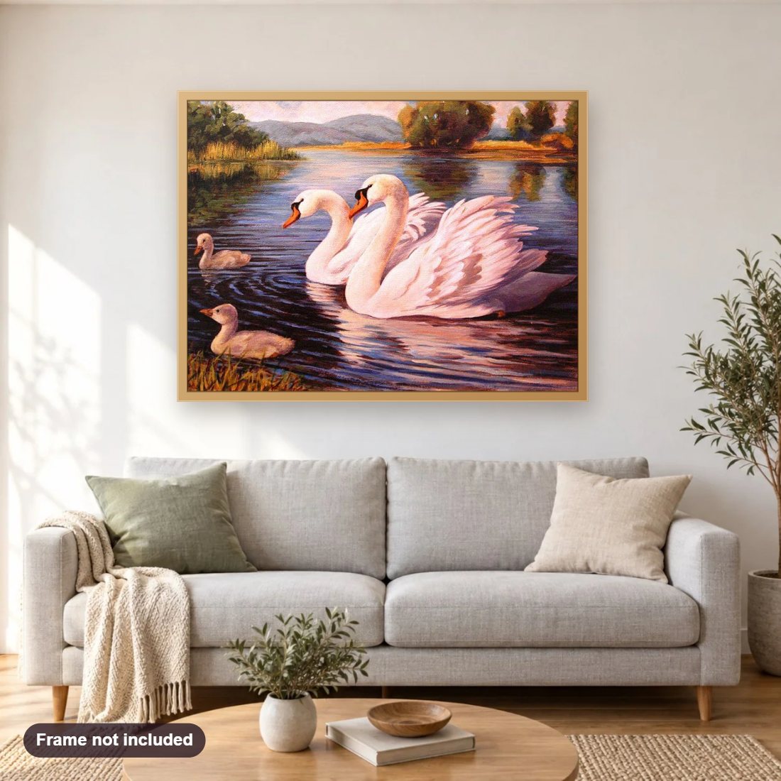 Swan Family in the Lake diamond painting shown framed on a living room wall above a sofa