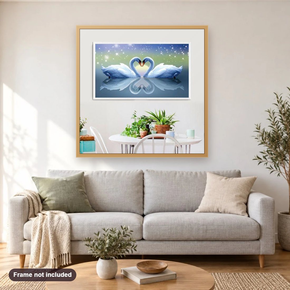 Swan Pair | diamond painting shown framed on a living room wall above a sofa