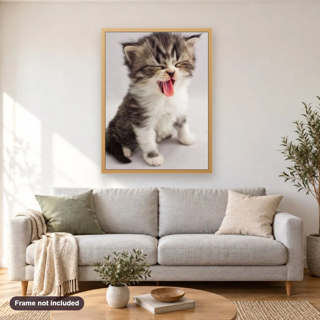 Sweet Kitten Yawning diamond painting shown framed on a living room wall above a sofa