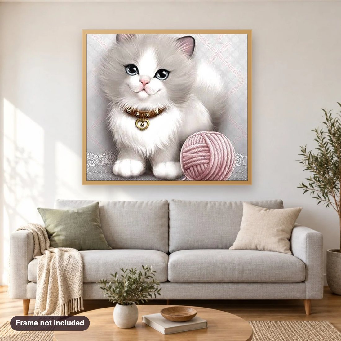 Sweet Kitty with Ball of Yarn diamond painting shown framed on a living room wall above a sofa