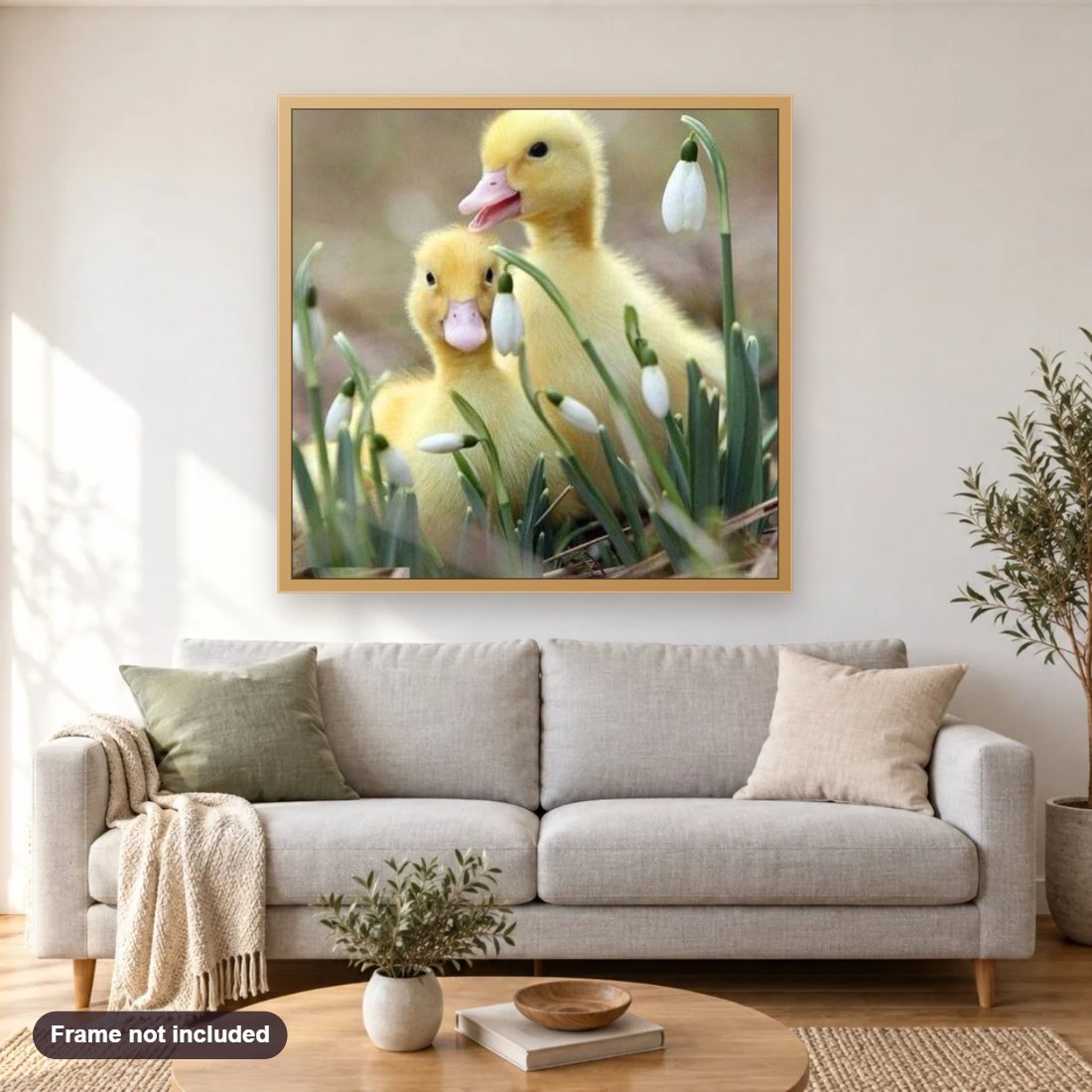 Sweet Little Ducklings diamond painting shown framed on a living room wall above a sofa