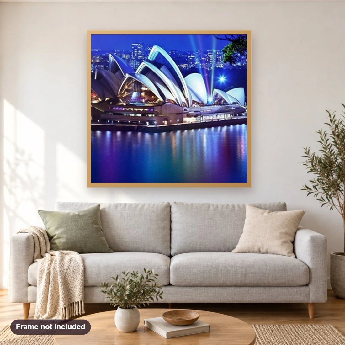 Sydney Opera House diamond painting shown framed on a living room wall above a sofa