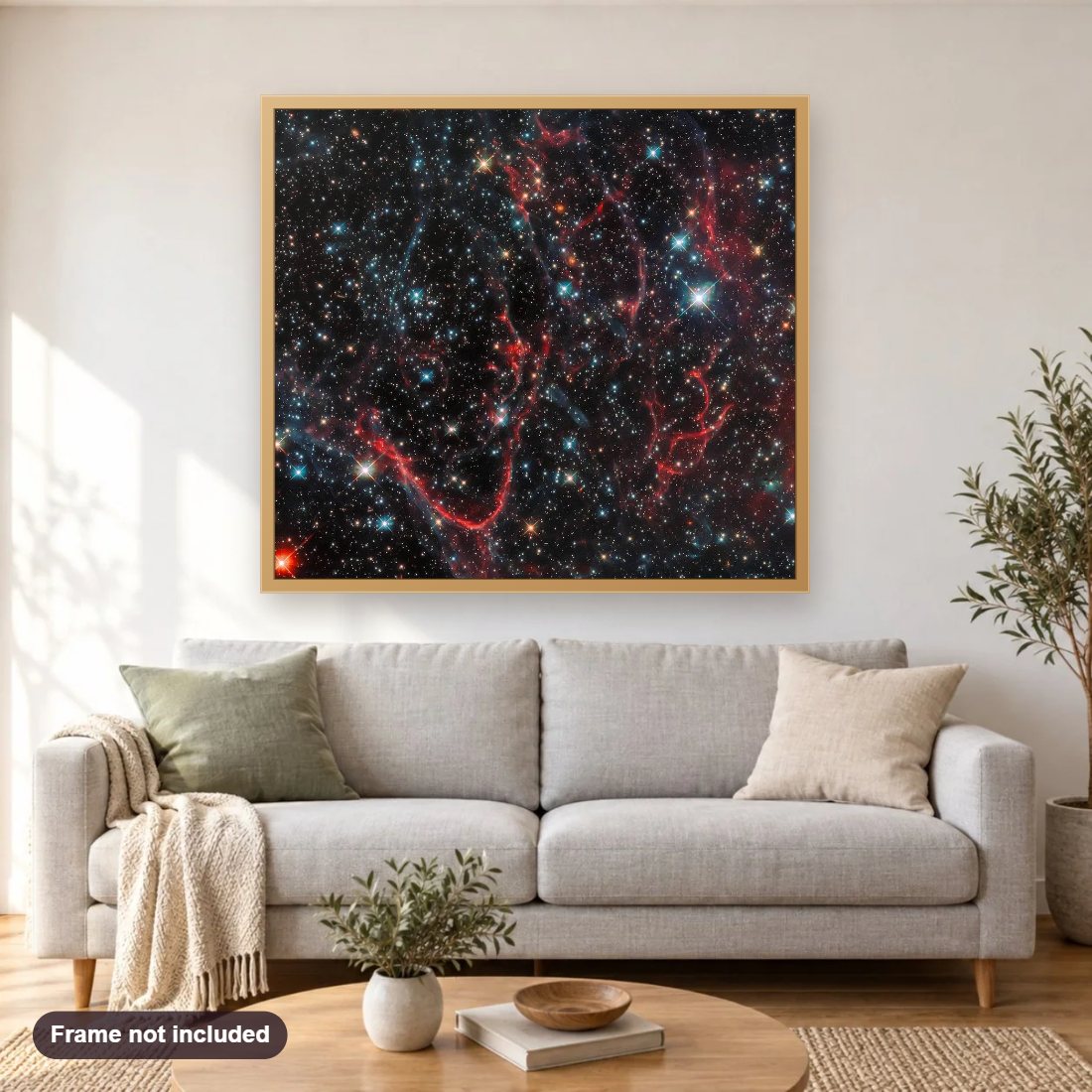 Tangled Remnants of a Supernova diamond painting shown framed on a living room wall above a sofa