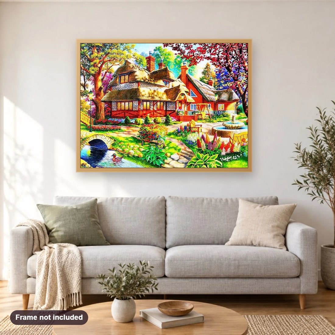 The Dream Home diamond painting shown framed on a living room wall above a sofa