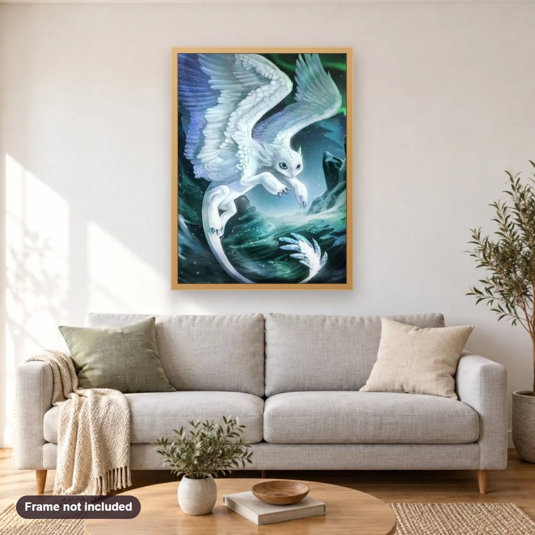 The Mythical Frost Feather diamond painting shown framed on a living room wall above a sofa