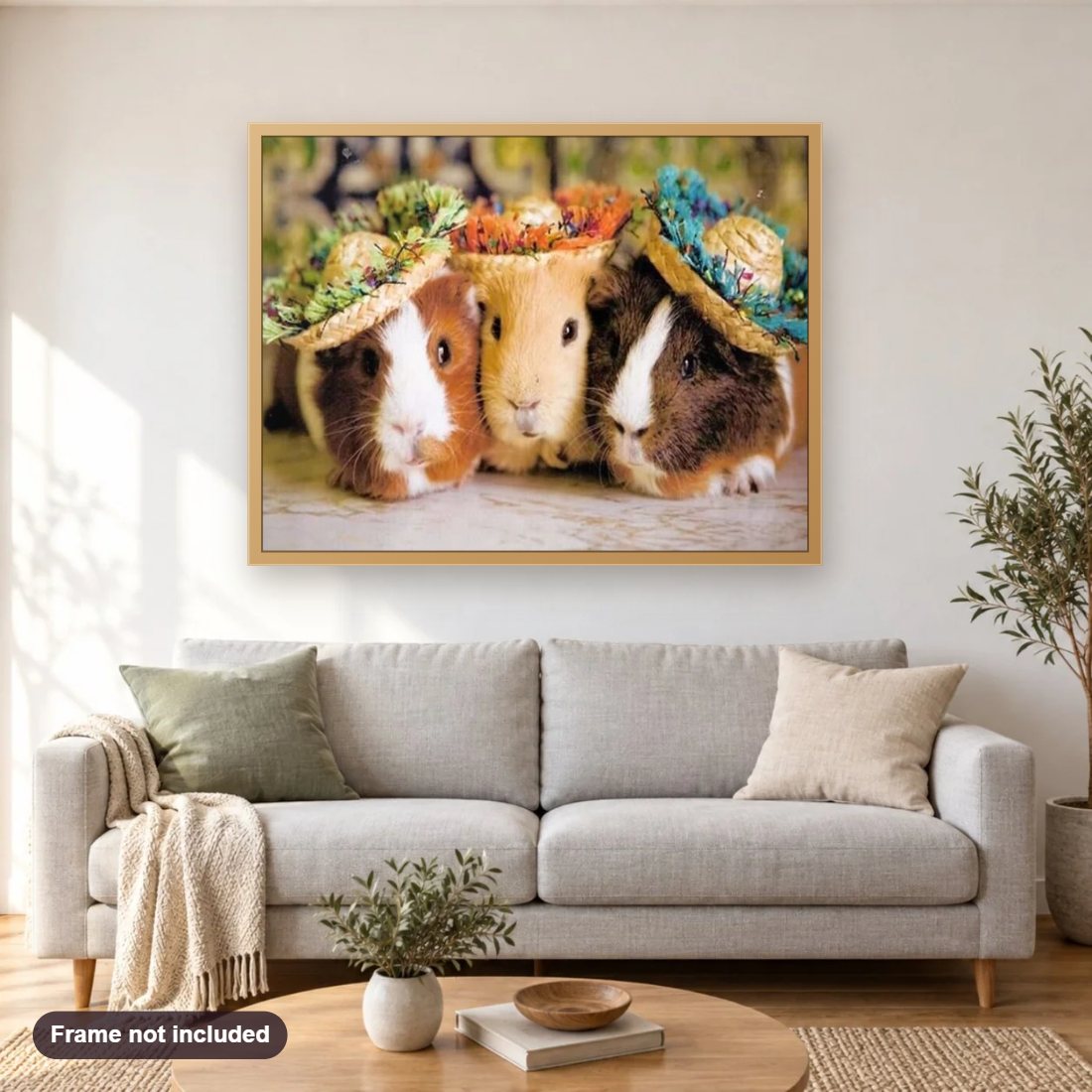 Three Guinea pigs in Hats diamond painting shown framed on a living room wall above a sofa