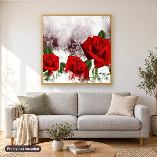 Three Red Roses diamond painting shown framed on a living room wall above a sofa