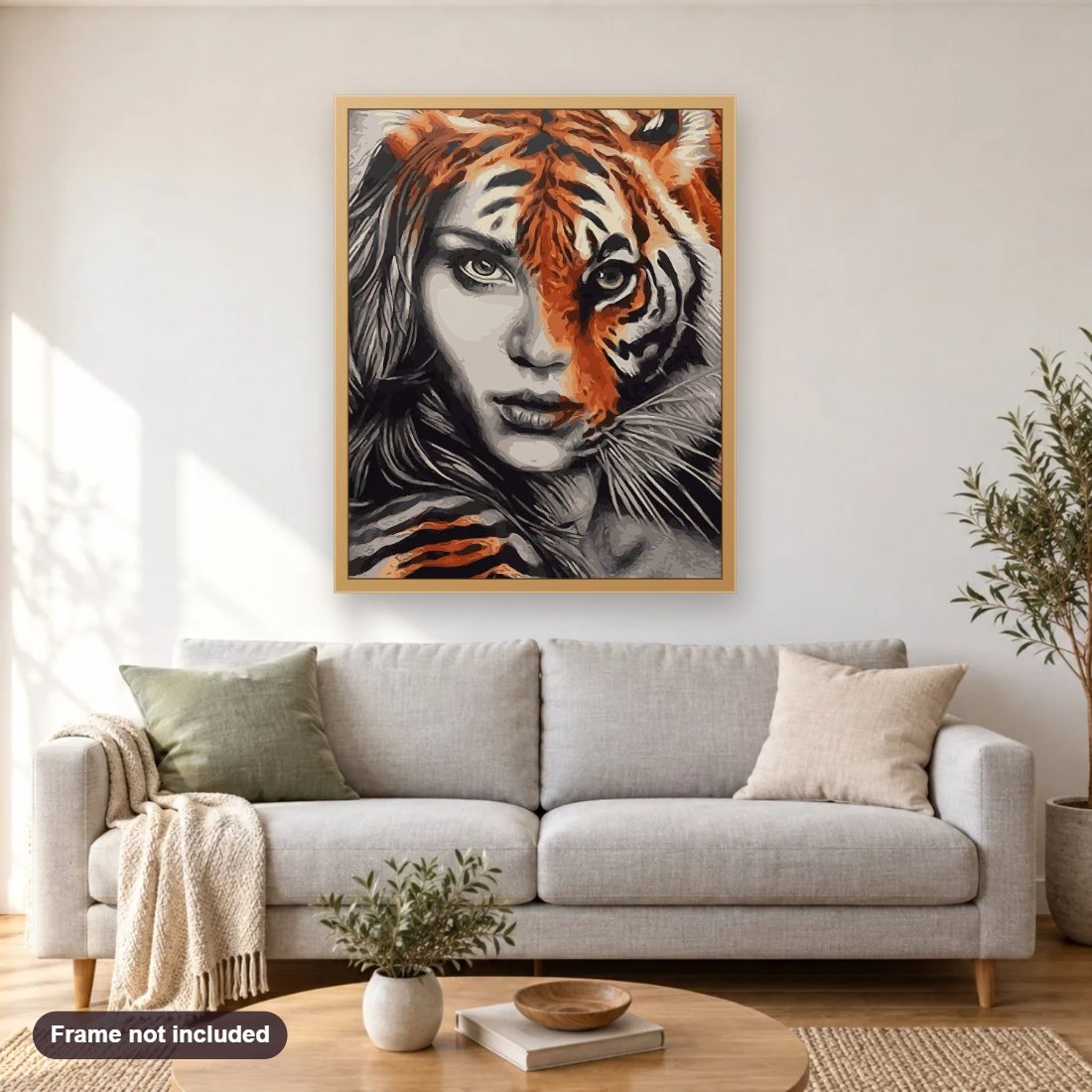 Tiger Lady diamond painting shown framed on a living room wall above a sofa