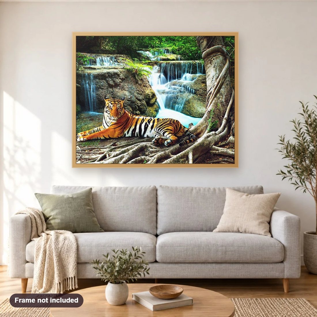 Tiger Resting by Waterfall diamond painting shown framed on a living room wall above a sofa
