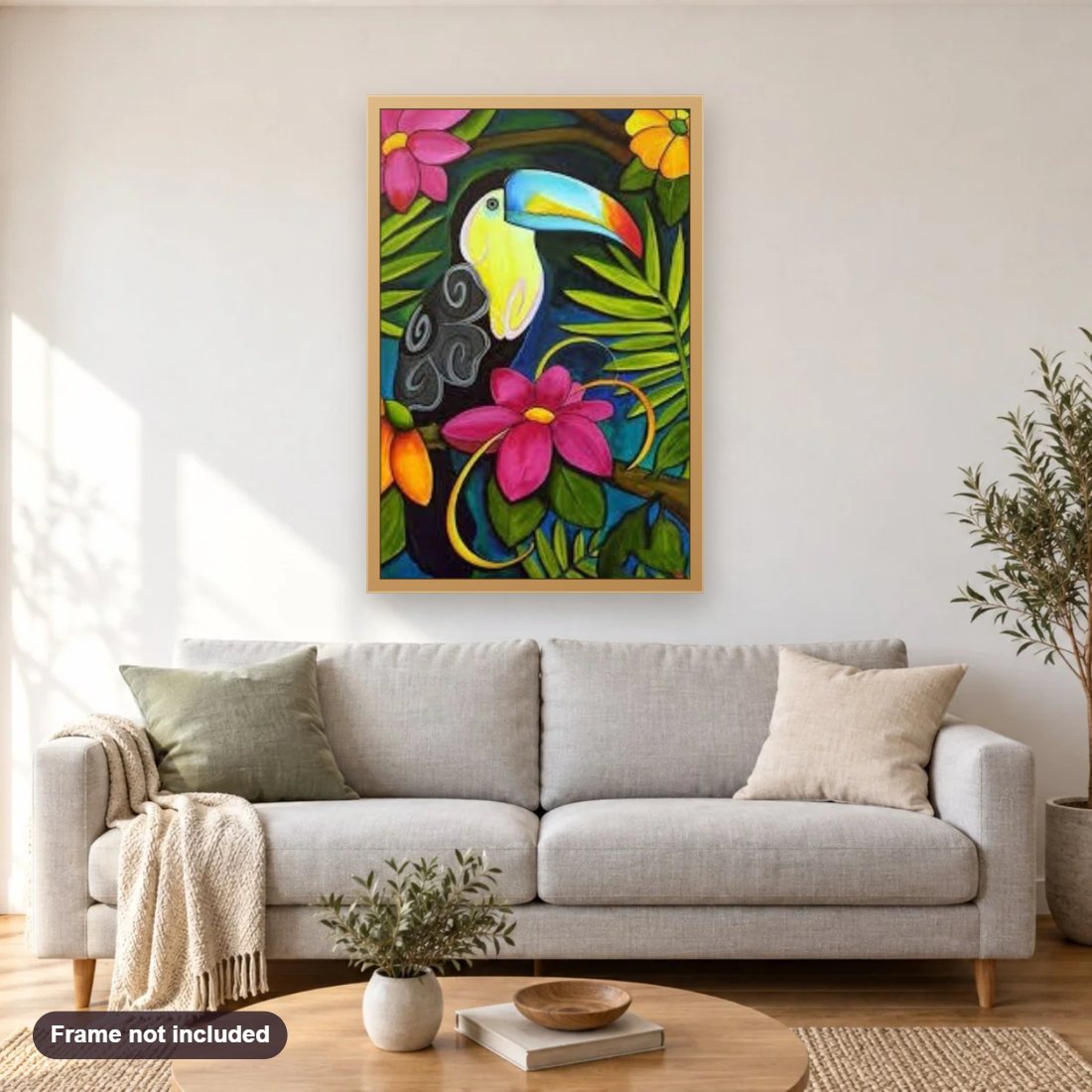 Toucan & Flowers diamond painting shown framed on a living room wall above a sofa