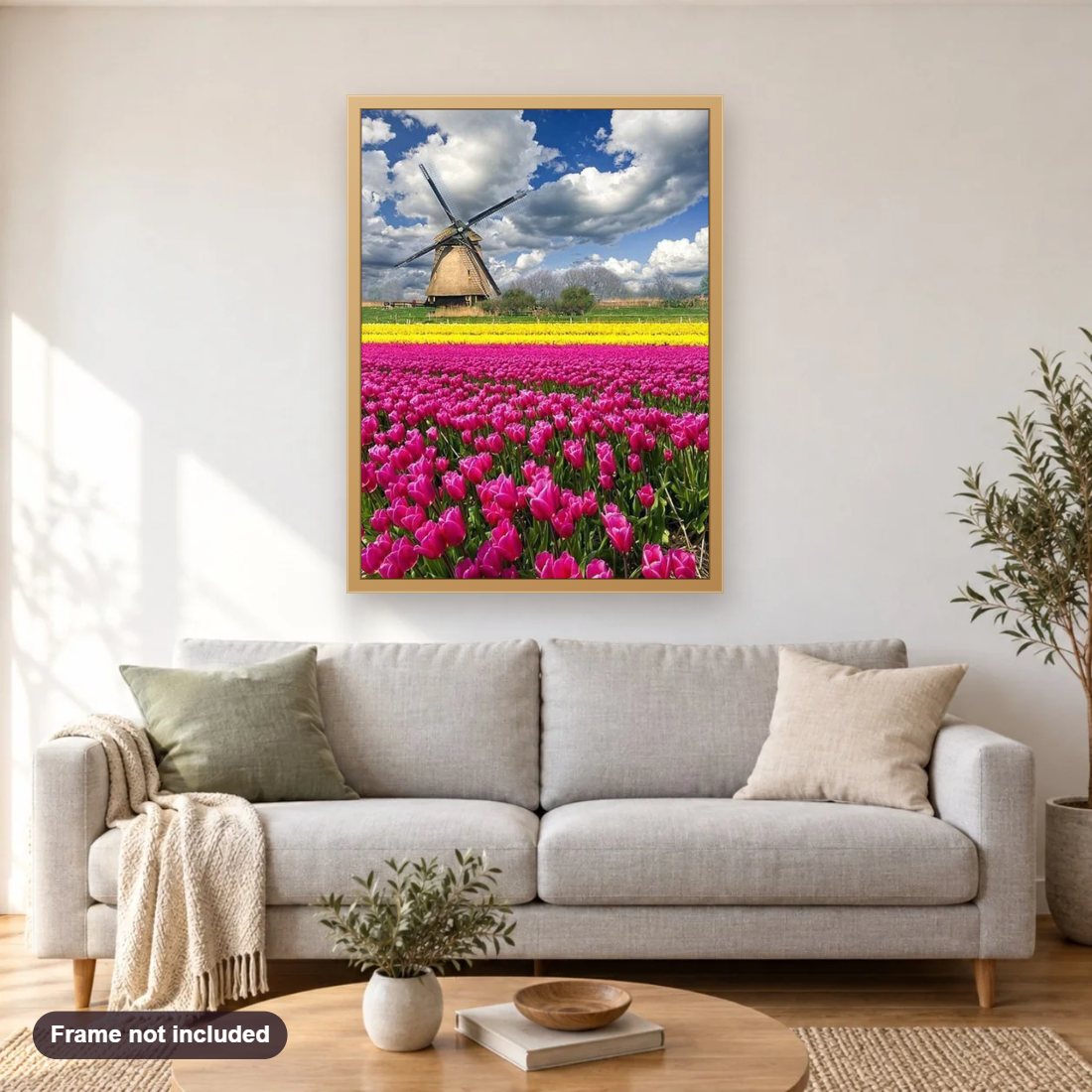 Tulip Garden & Windmill diamond painting shown framed on a living room wall above a sofa