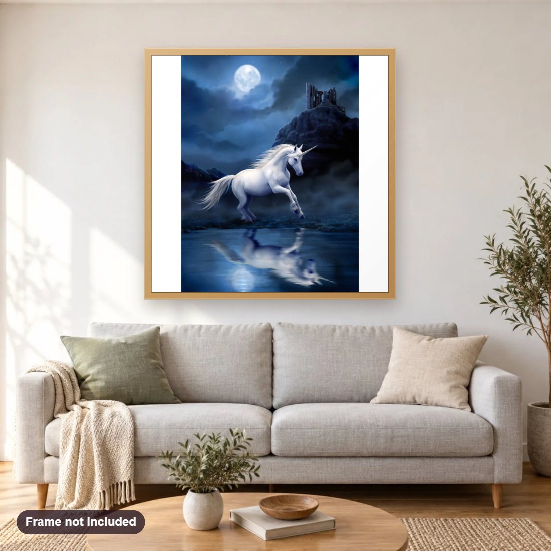 Unicorn & Full Moon Night diamond painting shown framed on a living room wall above a sofa