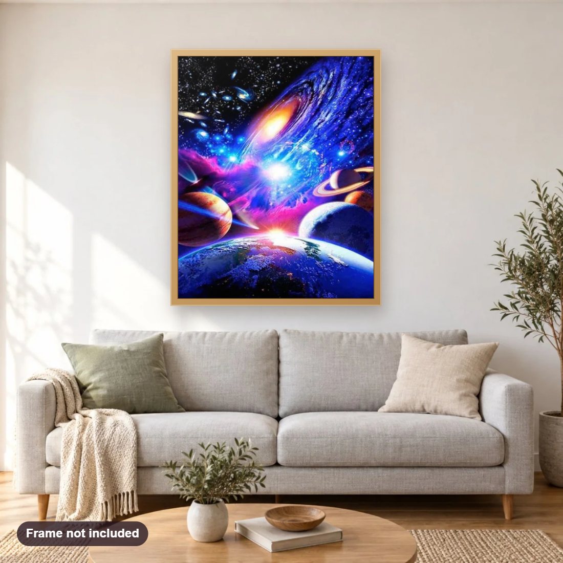 Universe diamond painting shown framed on a living room wall above a sofa