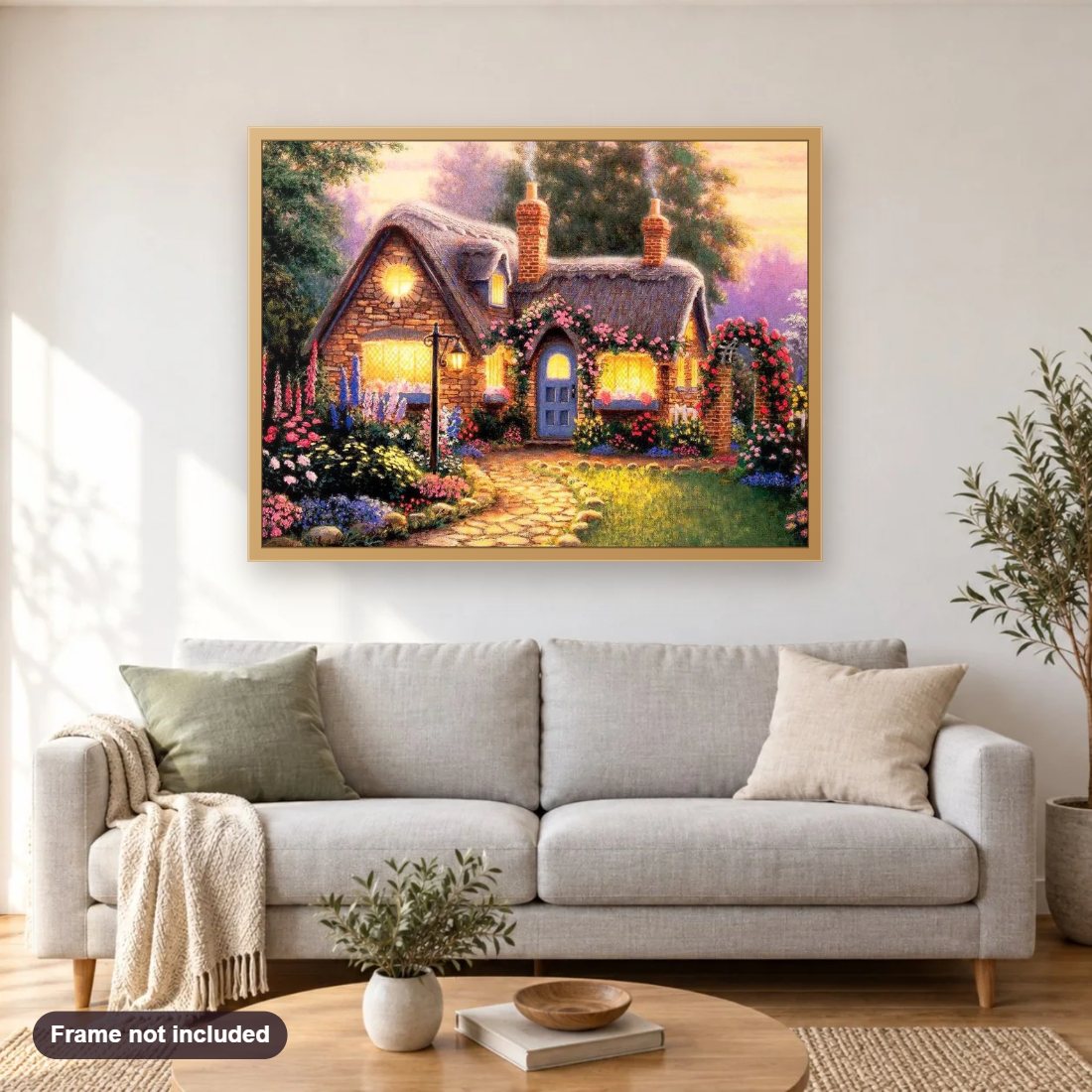 Beautiful Cottage with Flowers Decoration diamond painting shown framed on a living room wall above a sofa