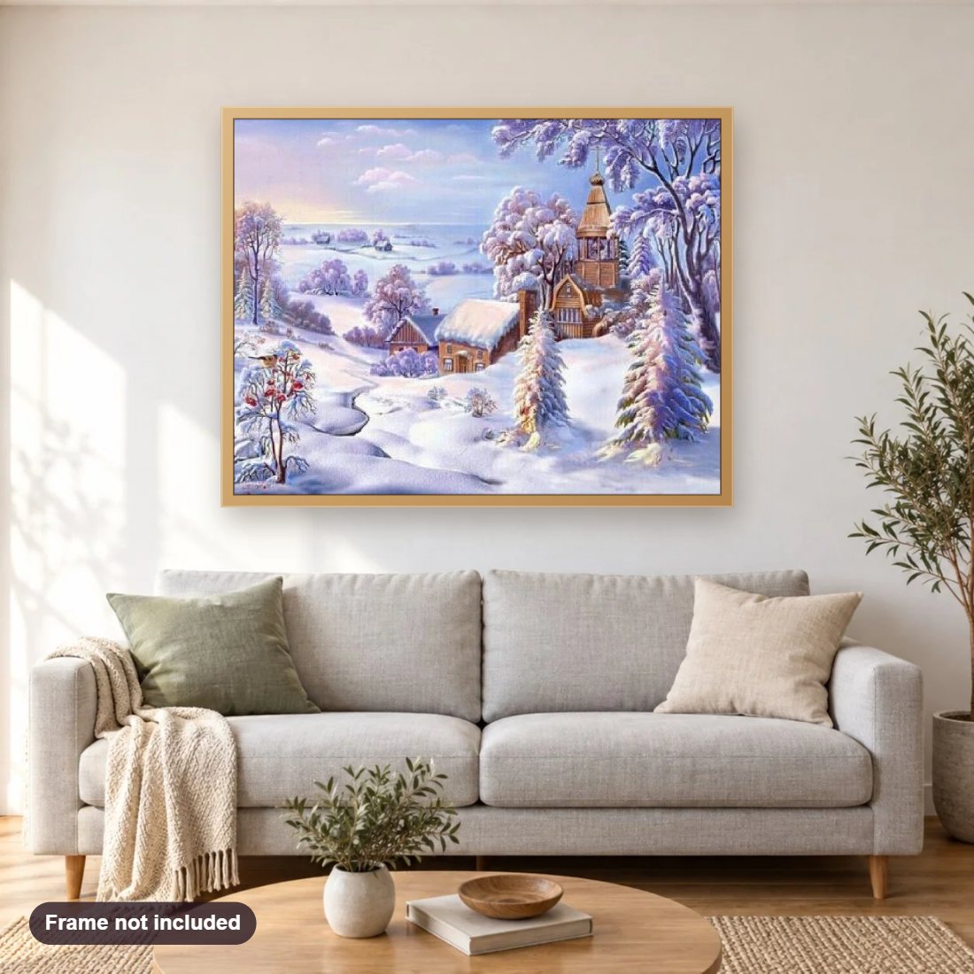 Village under Snow diamond painting shown framed on a living room wall above a sofa