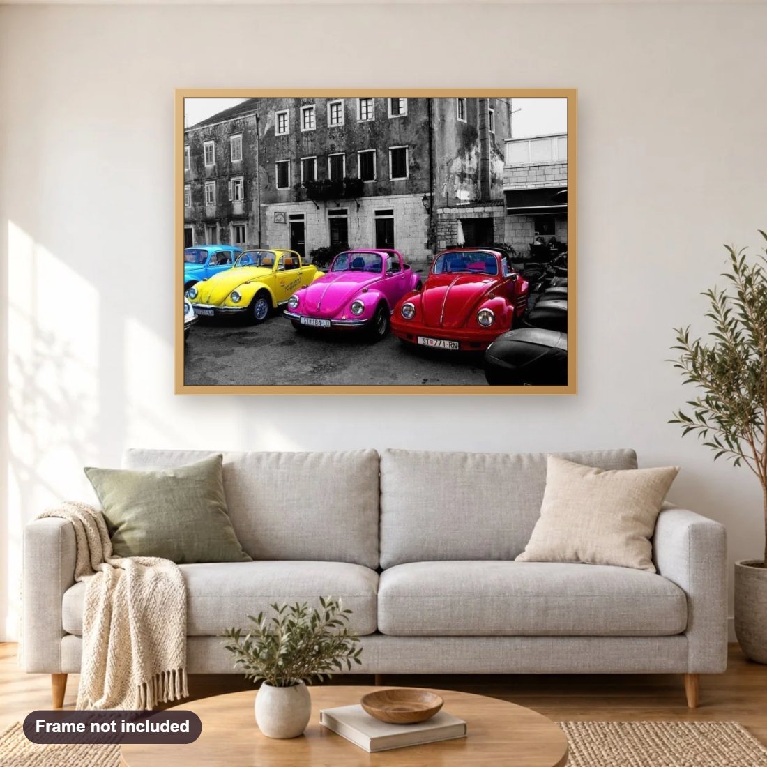 Vintage cars and old city diamond painting shown framed on a living room wall above a sofa