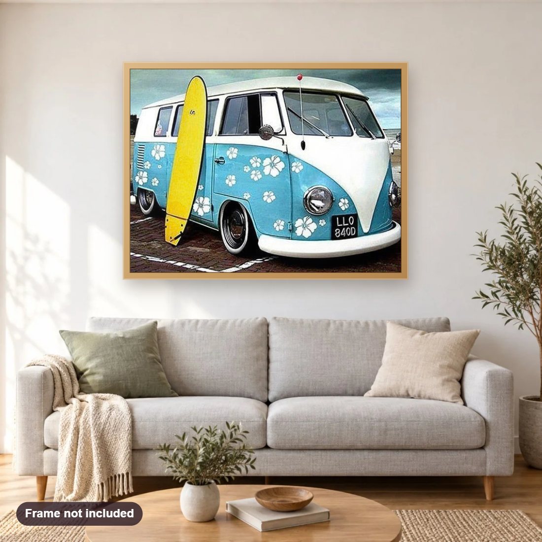 Volkswagen Type 2 mini bus & Surfboard diamond painting shown framed on a living room wall above a sofa