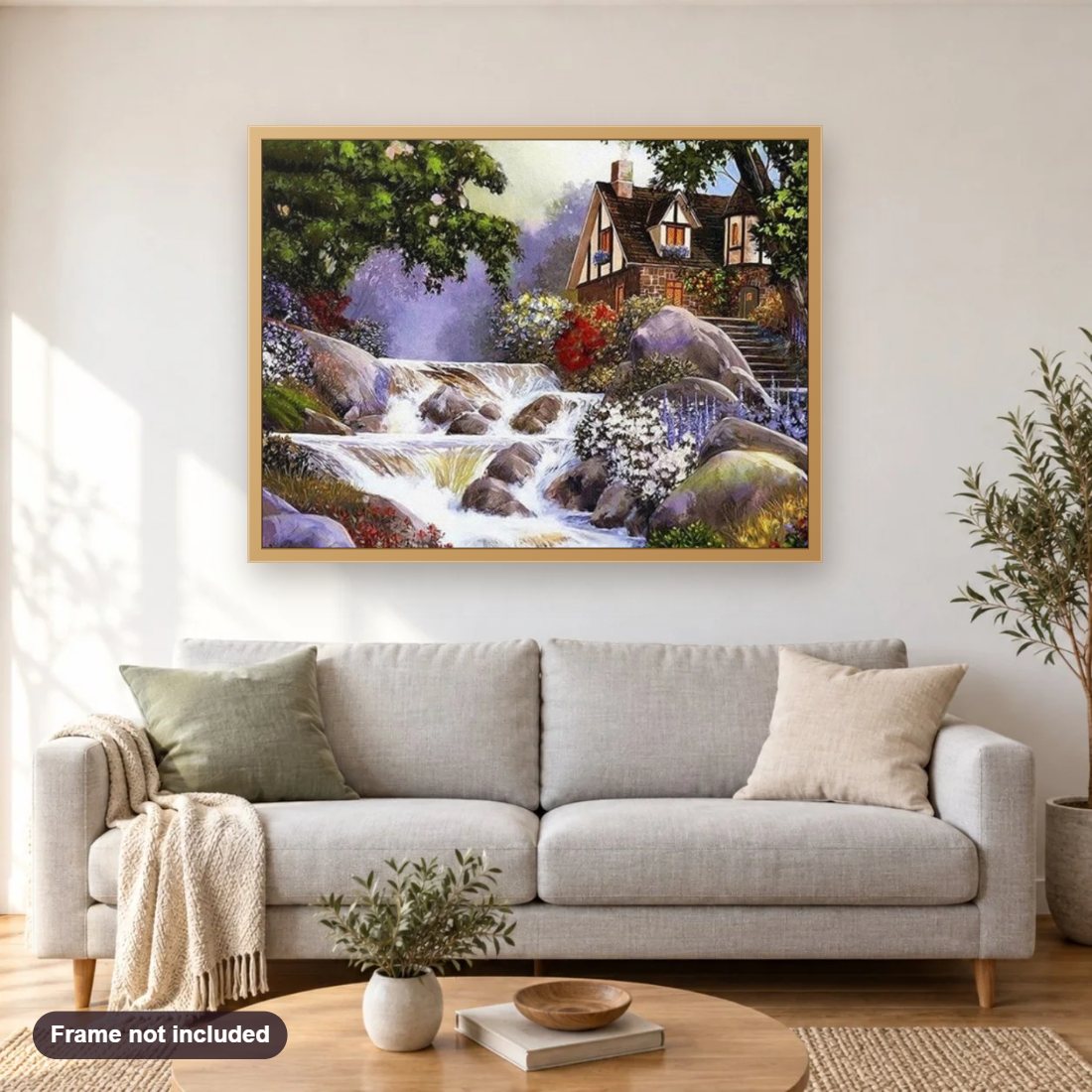 Waterfall & Beautiful House diamond painting shown framed on a living room wall above a sofa