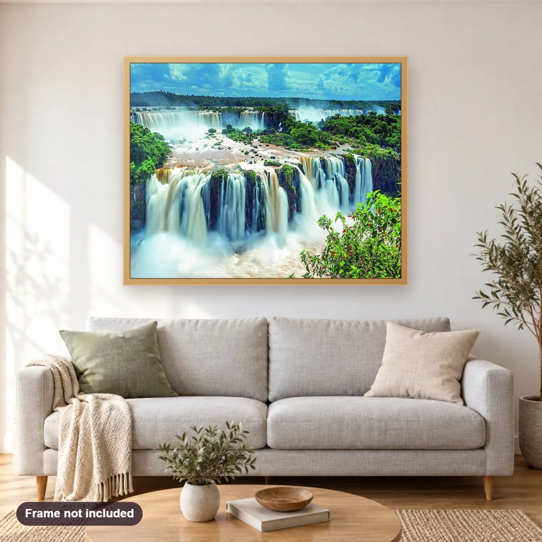 Waterfall diamond painting shown framed on a living room wall above a sofa