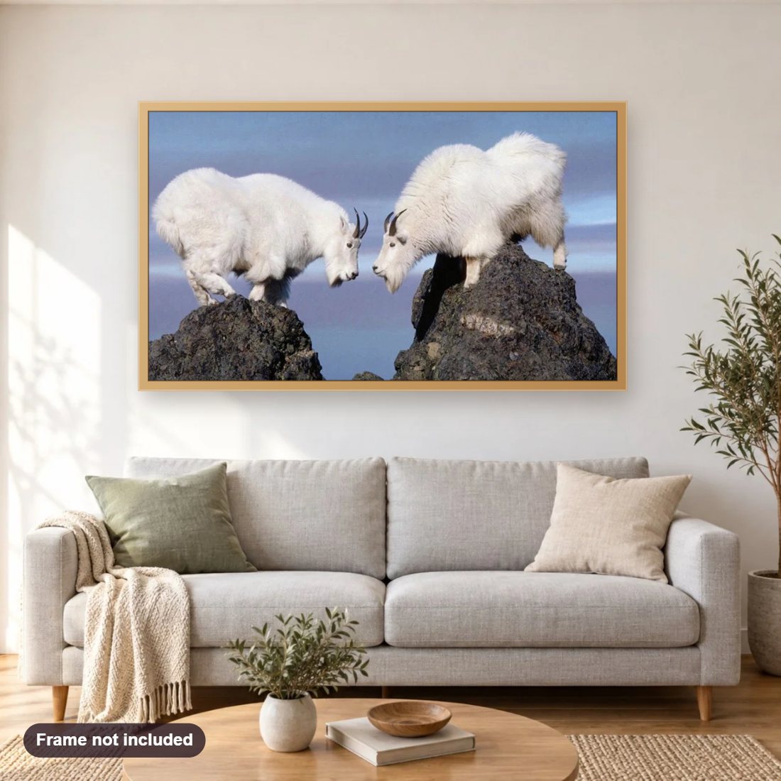 White Mountain Goats diamond painting shown framed on a living room wall above a sofa