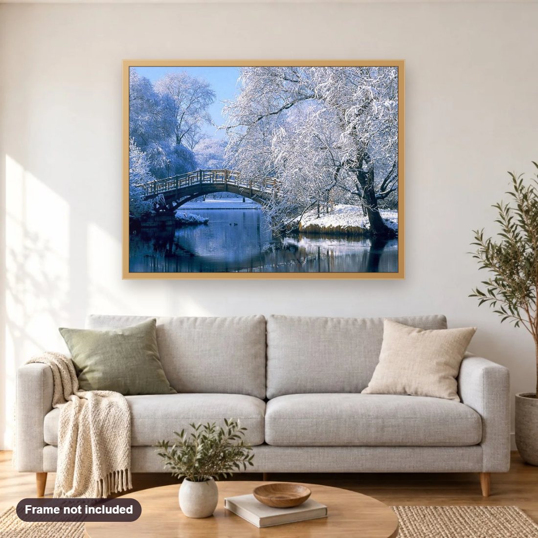Winter Landscape diamond painting shown framed on a living room wall above a sofa