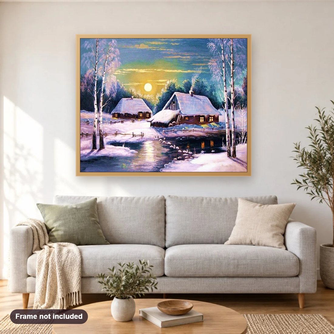 Winter Sunset Landscape diamond painting shown framed on a living room wall above a sofa