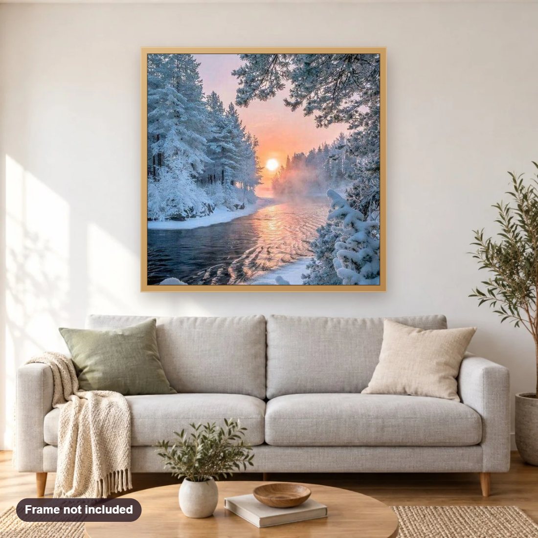 Winter Trees & Sunset diamond painting shown framed on a living room wall above a sofa