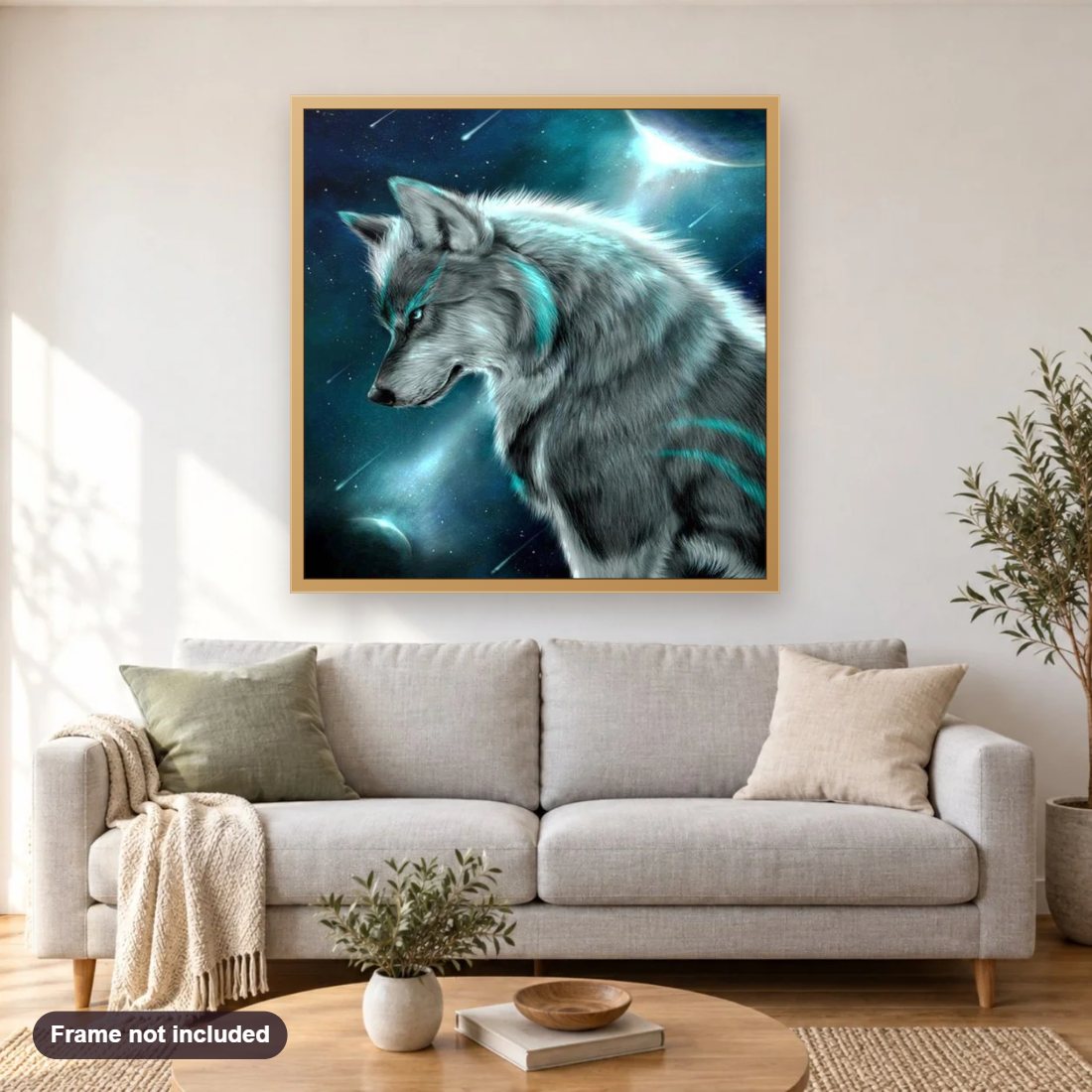 Wolf under Moon diamond painting shown framed on a living room wall above a sofa