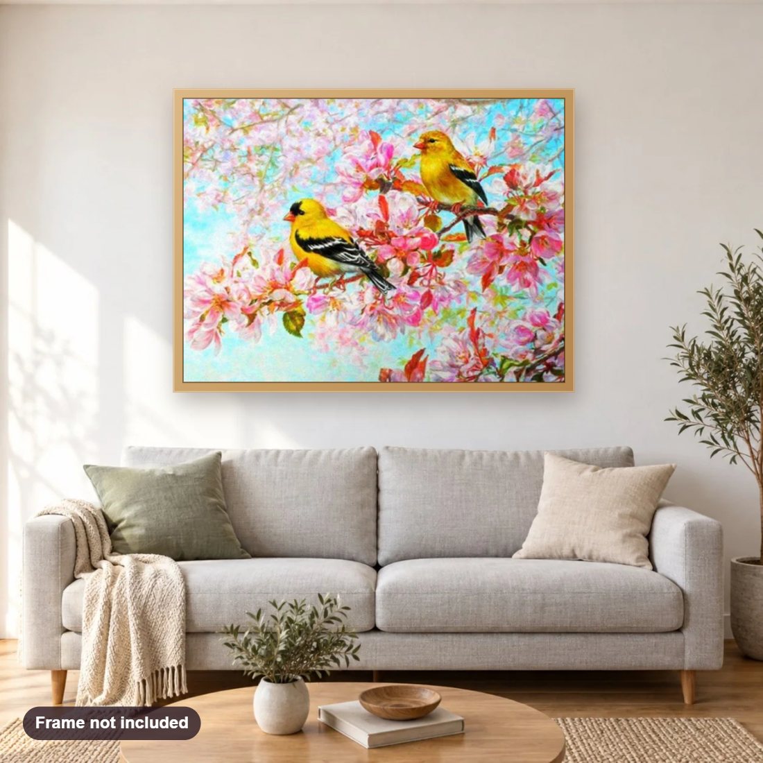 Yellow Birds & Pink Blossoms diamond painting shown framed on a living room wall above a sofa