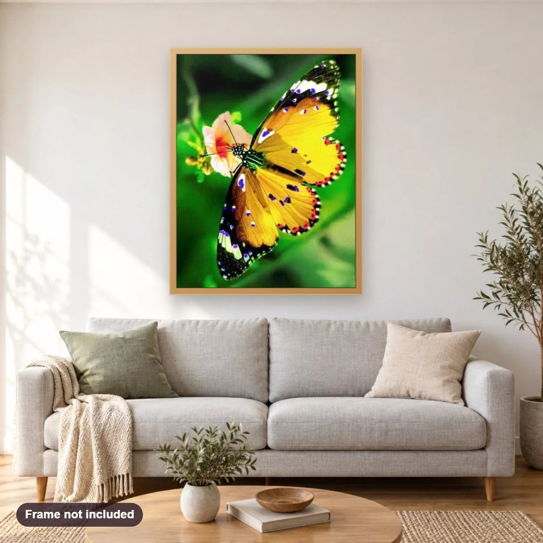 Yellow Butterfly diamond painting shown framed on a living room wall above a sofa